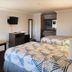 Motel 6 Crowley, La guest room with two beds, desk, TV, and dresser