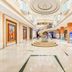 Hulunbeier Hotel in Hulunbuir grand lobby with staircase, circular ceiling and art displays