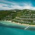 Conrad Koh Samui in Ko Samui, aerial view of hillside villas and a pier over turquoise water
