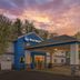 Best Western Brockport Inn & Suites exterior with covered entrance at sunset in Brockport