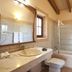 Agroturismo Es Quatre Cantons bathroom in Binissalem with marble vanity, bathtub and glass shower