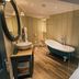 Greenbank Hotel Falmouth bathroom with freestanding tub, walk-in shower and vanity