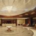 Yashail Hotel Haridwar lobby with grand chandelier, circular floor design, and front desk in Haridwar