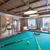 Hotel Panorama in Finkenberg: billiards room with pool table, seating, and mountain-view windows