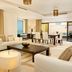 Hilton Dubai The Walk Dubai living and dining room with sea views and floor-to-ceiling windows