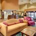 Comfort Suites Texarkana lobby with sofa seating and front desk area