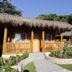 Magic Oceans Dive Resort in Anda: thatched-roof cottages with tropical gardens and walkway