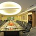 Huangtai International Hotel Jinan conference room with long boardroom table and black leather chairs