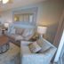Pelican Beach Resort & Conference Center in Destin living room with sofa, armchairs and coffee table
