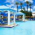 Beau Rivage Resort and Casino in Biloxi with a poolside cabana and blue lounge chairs by the pool