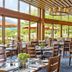 Topnotch Resort, Stowe dining room with large windows overlooking outdoor seating and mountain views