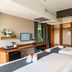 Dang Derm In The Park Khaosan Bangkok guest room with twin beds, desk, and wardrobe
