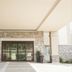 Hampton Inn By Hilton Elliot Lake entrance with stone columns and glass doors in Elliot Lake