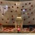 Tongadale Hotel in Portree display with white drape, red flowers, lantern and candles