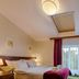 Hotel Yarden by Artery Hotels in Krakow: guest room with double bed, balcony doors, and wardrobe
