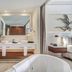 Hideaway at Royalton Negril bathroom with freestanding tub, double vanity and frosted glass shower