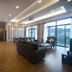 Nova Highlands Hotel Brinchang suite with living area, dining table, staircase and mountain-view balcony