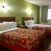 Red Carpet Inn - New Brunswick room with two beds, green walls and a window