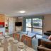 James Street Motor Inn Toowoomba guest suite with kitchen, dining table, lounge and patio door