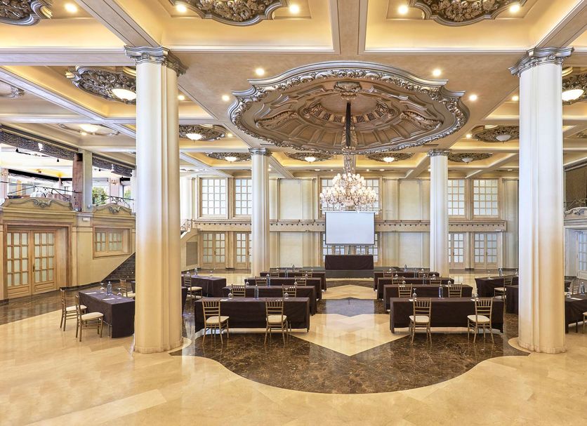 Grand event hall at NH Collection A Coruña Finisterre in A Coruña with chandeliers and ornate ceiling