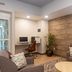 Candlewood Suites New Bern lobby with seating, work desk, and wood accent wall in New Bern