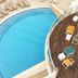 Eix Alcudia Hotel +18 in Alcúdia: curved outdoor pool beside rows of sun loungers and a terrace
