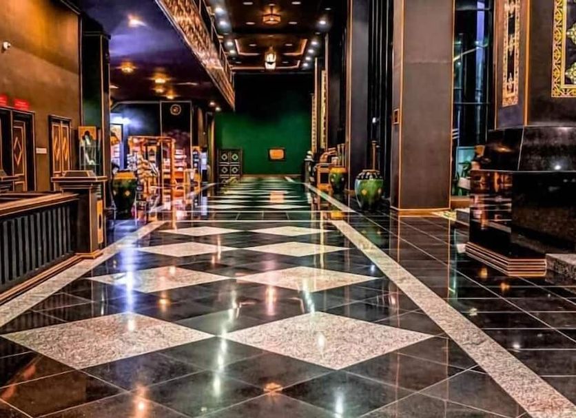 Mudzaffar Hotel, Malacca lobby with glossy black-and-white tiled floor and ornate interior