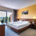 Hotel Salinera, Strunjan guest room with double bed, balcony doors and partial sea view