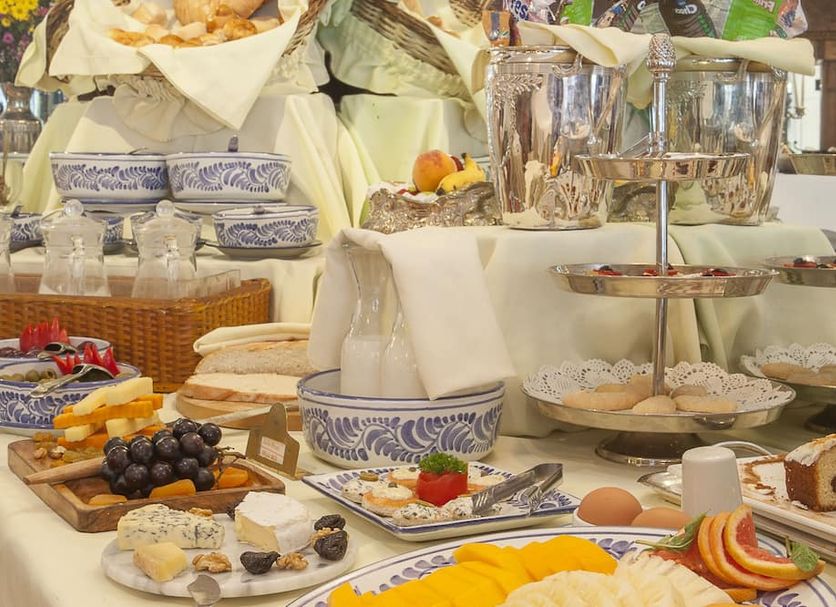 Antara Hotel & Suites - Miraflores buffet table with pastries, fruit, and desserts in Lima