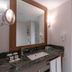 Royal Teos Thermal Resort Clinic & Spa bathroom vanity with mirror and glass shower in Seferihisar