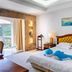 Grand Bayview Hotel Ningbo room with king bed, ocean-themed decor, and balcony view in Ningbo
