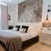 LE 5 Terre LA Spezia guest room with large bed, hanging lamp and ornate wall art