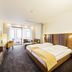 Flair Hotel zum Schiff Meersburg room with double bed, seating area, and balcony view