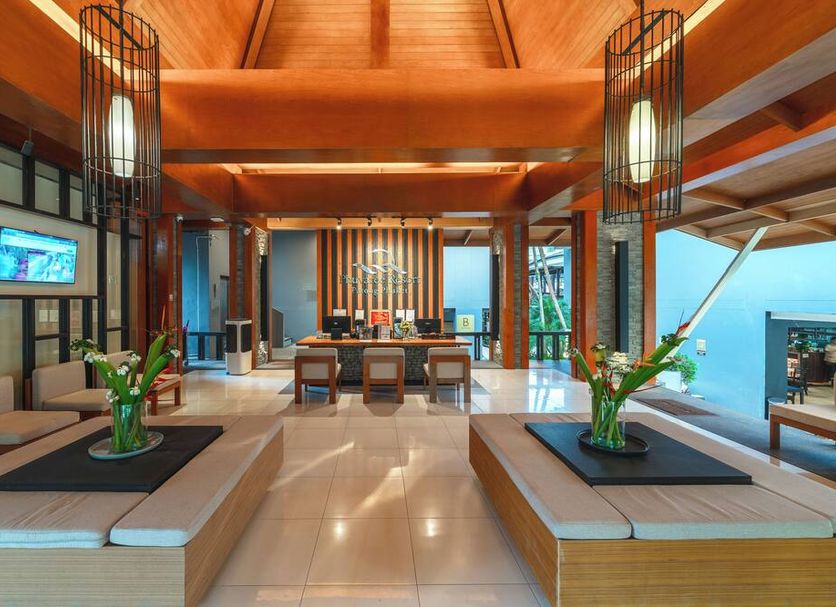Phuvaree Resort in Patong lobby with wooden beams, seating areas, and ocean view