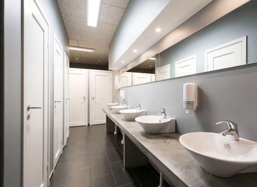 Winstrup Hostel Lund shared bathroom with double sinks, mirrors and white doors