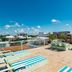 Hotel Boutique Rato 10 in Playa del Carmen rooftop terrace with loungers, seating, and ocean view