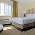 Candlewood Suites Killeen - Fort Hood Area by IHG room with bed, armchair, and window in Killeen