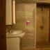 Seven Rock Cave Hotel in Göreme bathroom with sink and open walk-in shower carved into stone