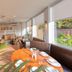 Countryman Motor Inn in Dubbo dining area with tables, booths, and large windows