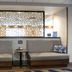 Hampton Inn Crystal River lobby seating area with gray benches and decorative privacy screen