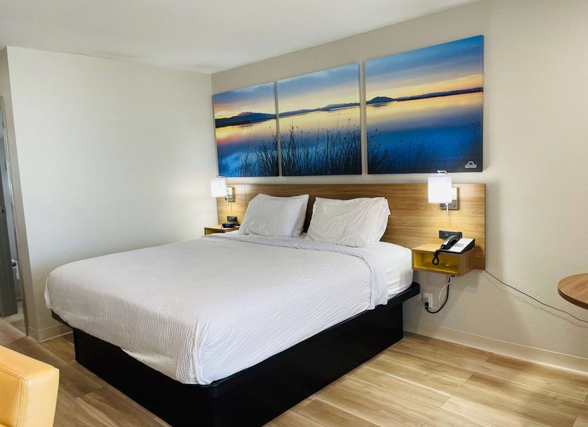 Days Inn by Wyndham Killeen Fort Hood guest room with king bed and scenic wall art