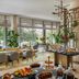 Four Seasons Hotel Bengaluru at Embassy One buffet dining area with large windows and greenery views