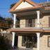 Tushita Nepal Yoga Retreat Center in Pokhara, two-story retreat building with balcony and mountain views