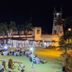 Campago Resort Hotel in Bukittinggi with illuminated lawn dining area and tower at night