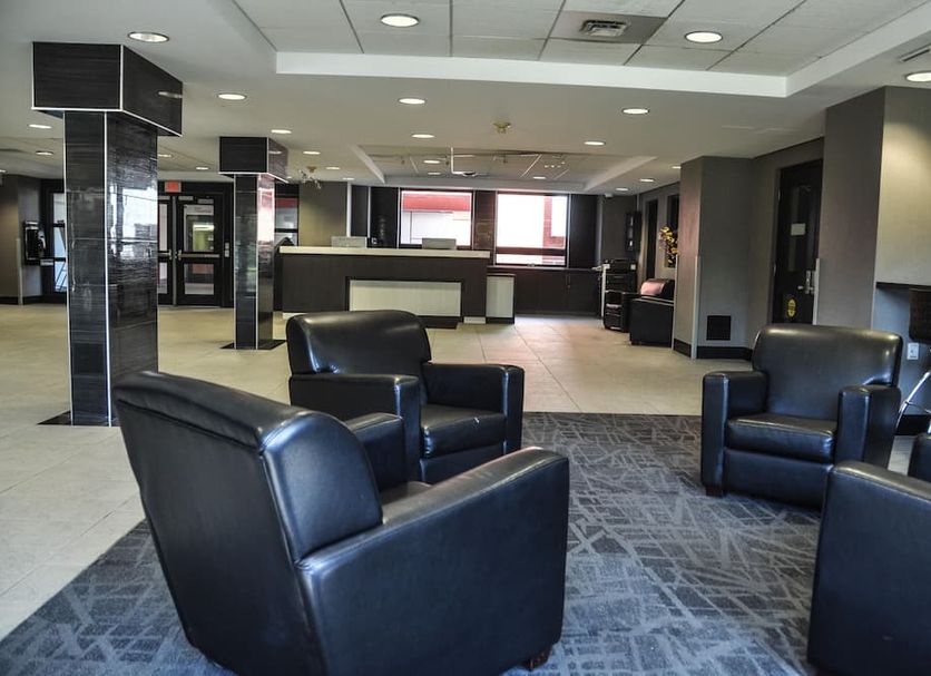 Residence & Conference Centre - Oakville lobby with black leather chairs and reception area