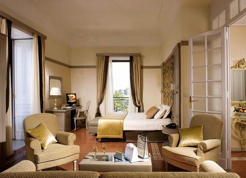 Grand Hotel Europa Palace Sorrento room with balcony view, bed, seating area and classic decor