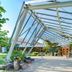 Hohenwart Forum in Pforzheim, entrance with modern glass canopy and landscaped courtyard