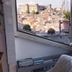 Il Camaleonte dal 2005 in Bracciano with open window view of castle and town rooftops