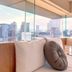 Eastin Taipei Hotel in Taipei City room with floor-to-ceiling windows and Taipei skyline views