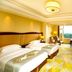Dongjiao State Guesthouse Nanjing guest room with two beds, sitting area and city view
